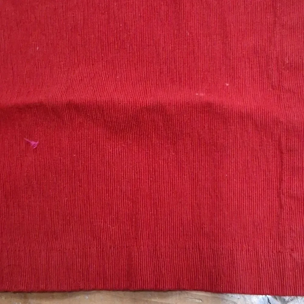 Set of 7‎ red corduroy placemats.